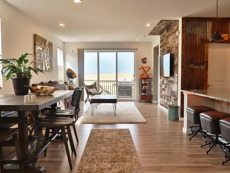 Living room opening to the prairie-view deck