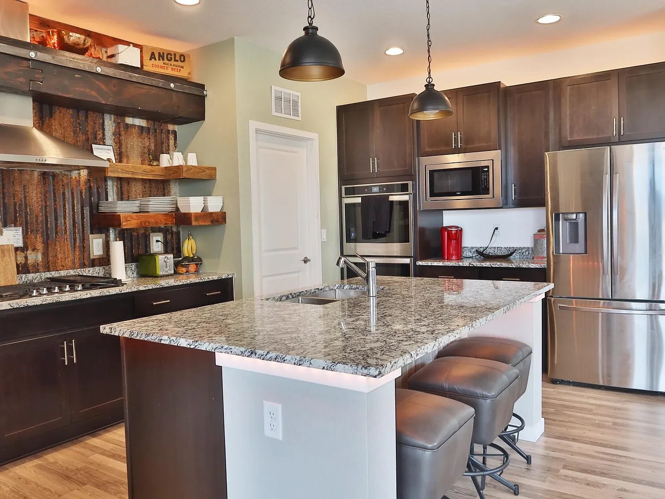 Chef's kitchen: gas range, double oven, granite island
