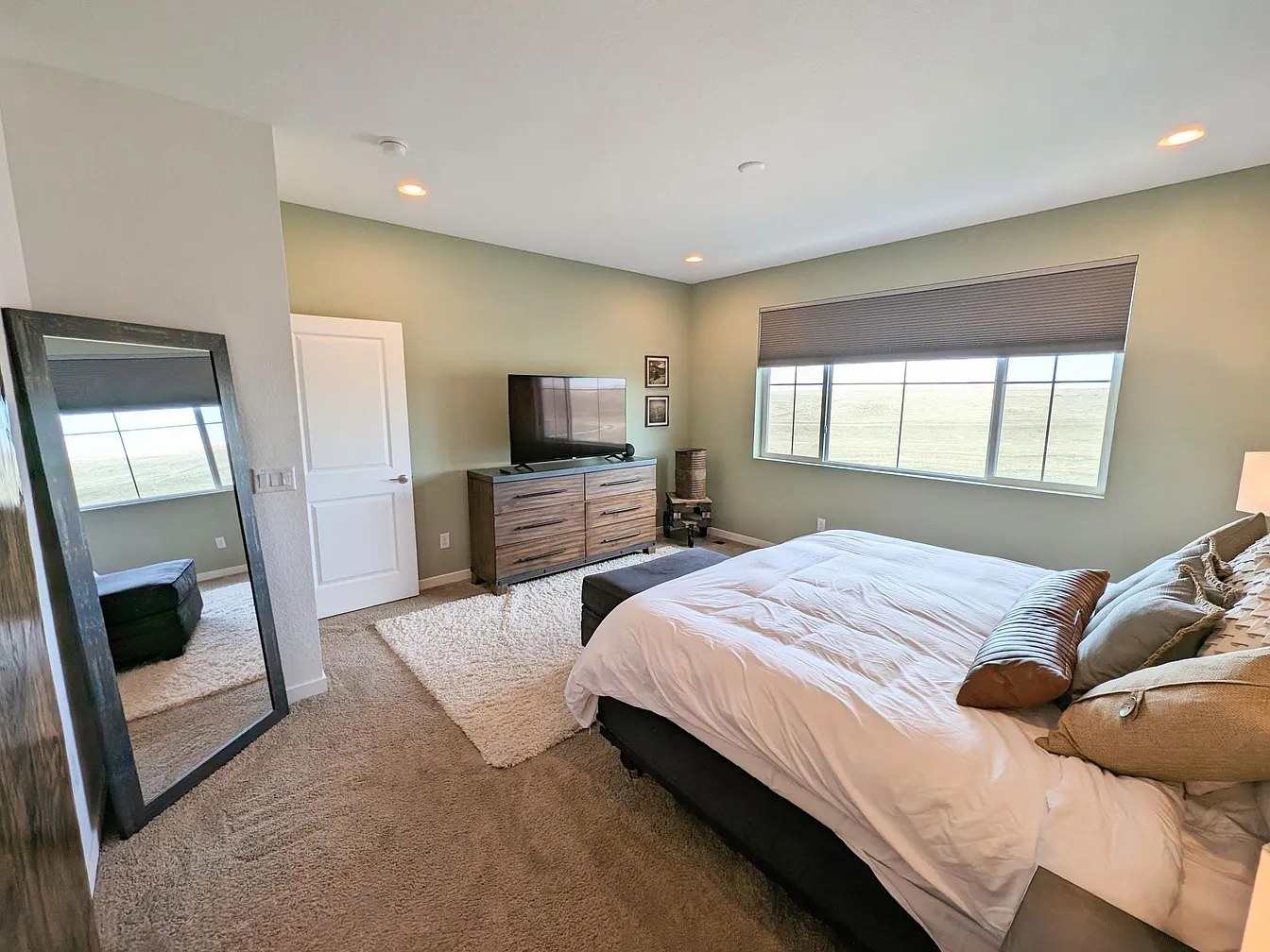 Main-level master bedroom with prairie picture window